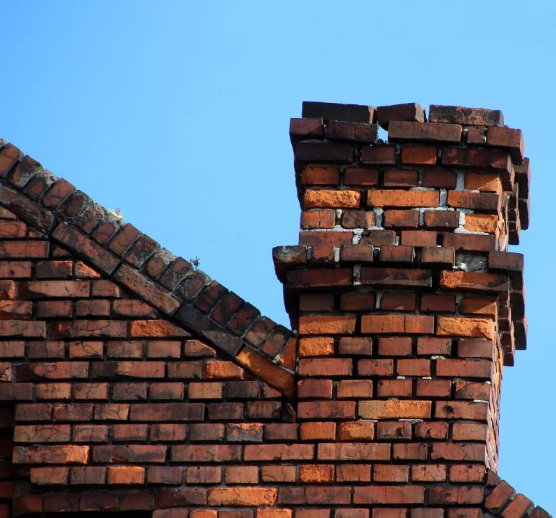 Signs Your Halethorpe Home Needs a Chimney Inspection Blog Article - Damaged chimney on an Halethorpe home showing cracks and missing mortar